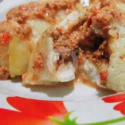 Lontong Oncom Yang Dicampur Dengan Bumbu Kacang