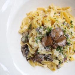 Mushroom Tagliatelle W/ White Truffle Cream & Black Truffles